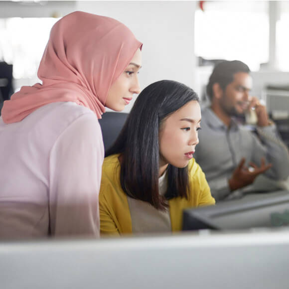 two women working on the compliance hotline