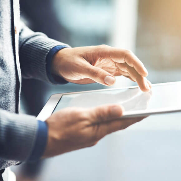 a man holding a tablet for hipaa compliance policy templates